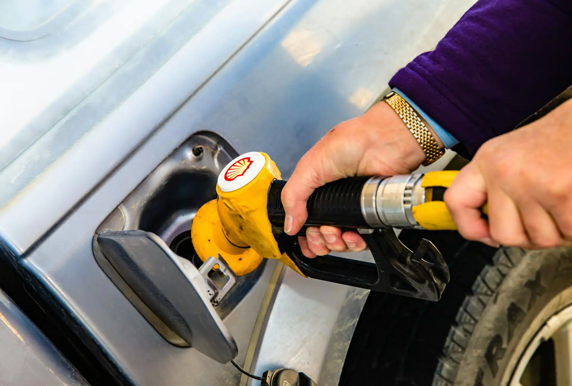 Petrol Nozzle into a Car